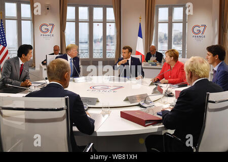 Canada's Prime Minister Justin Trudeau, Prime Minister Boris Johnson, Germany's Chancellor Angela Merkel, European Council President Donald Tusk, France's President Emmanuel Macron, Japan's Prime Minister Shinzo Abe and US President Donald Trump meet for the first working session of the G7 Summit in Biarritz, France.