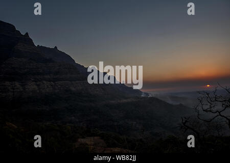 Thana district Maharashtra  March 13-2005 Silhouette of a malshej ghat and mountain ranges in the Western Ghats INDIA asia Stock Photo