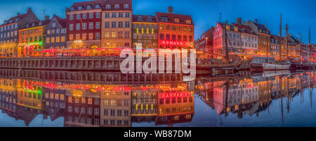 Nyhavn (New Harbour), Copenhagen, Denmark - 14 JMay 2019: Panoramic view of Nyhavn pier with color buildings, ships, yachts and other boats in the Old Stock Photo