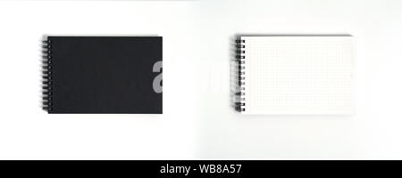 Notebook mock up with clean black blank for design and advertising. Notepad with chromed spring and free copy space template. On the gray background. Stock Photo