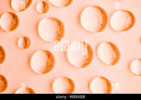 Water drops on orange abstract background, top view Stock Photo