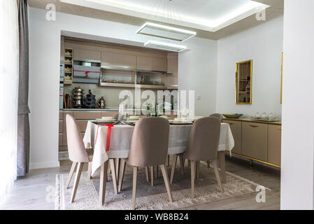 Modern gray kitchen with table set Stock Photo