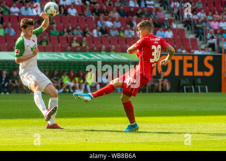 Augsburg, Germany. 24th Aug, 2019. Soccer: Bundesliga, FC Augsburg - 1st FC Union Berlin, 2nd matchday in the WWK-Arena. Michael Gregoritsch of Augsburg (l) blocks a shot from Berlin's Robert Andrich . Credit: Stefan Puchner/dpa - IMPORTANT NOTE: In accordance with the requirements of the DFL Deutsche Fußball Liga or the DFB Deutscher Fußball-Bund, it is prohibited to use or have used photographs taken in the stadium and/or the match in the form of sequence images and/or video-like photo sequences./dpa/Alamy Live News Stock Photo