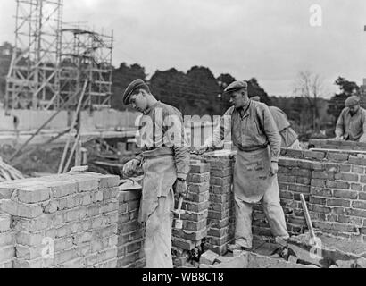 Builders in the 1940s. Two men are laying a brick wall. Sweden 1940s Stock Photo
