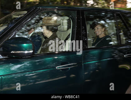 (front) Timothy Laurence and Princess Anne alongside with (back) Peter and Autumn Philips leave Crathie Kirk after the Sunday church service near Balmoral, where members of the royal family are currently spending their summer holidays. Stock Photo