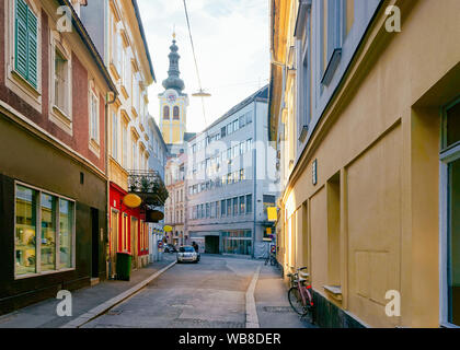 Cityscape street with Barmherzigenkirche Church at Old city of Graz in Austria. Styria in Europe.