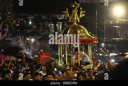 Lalitpur, Nepal. 24th Aug, 2019. Devotees carry palanquin of Hindu deity Bhimsen in celebration of Bhimsen Jatra or Bhimsen Festival at Patan Durbar Square in Lalitpur. (Photo by Archana Shrestha/Pacific Press) Credit: Pacific Press Agency/Alamy Live News Stock Photo