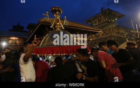 Lalitpur, Nepal. 24th Aug, 2019. Devotees offer prayers to Hindu deity Bhimsen in celebration of Bhimsen Jatra or Bhimsen Festival at Patan Durbar Square in Lalitpur. (Photo by Archana Shrestha/Pacific Press) Credit: Pacific Press Agency/Alamy Live News Stock Photo