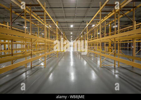 Empty Shelves In Empty Warehouse Stock Photo