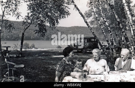 A vintage photograph of a family on a picnic in the country along the Hudson River in upstate New York during the summer of 1939. Stock Photo