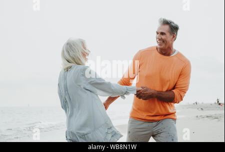 Happy senior couple spending time at the beach. Concepts about love,seniority and people Stock Photo