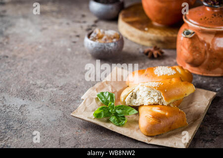 Homemade chicken and mushroom mini pies on paper Stock Photo