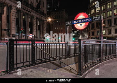 Underground signs in London streets at night Stock Photo