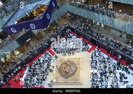 Tokyo, Japan. 25th Aug, 2019. Sumo wrestlers participate in a special Grand Sumo Tournament during the ''Hakkiyoi KITTE'' event held at KITTE commercial complex. Every year, visitors came to see the matches of top-division sumo wrestlers, including grand champions (Yokozuna), in a Tokyo regional tour ''Grand Sumo Tournament at KITTE'' that is held on the final day of the event. The Hakkiyoi KITTE event promotes the sumo culture to visitors to learn and experience Japan's national sport. The event is held at KITTE commercial complex inside the Japan Post building from August 13 to 25. Credit: Z Stock Photo