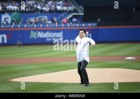 New York, USA. 24th Aug, 2019. Huang Ping, Chinese Consul General in New York, throws a ceremonial first pitch to start an MLB game between the Mets and the Atlanta Braves in Citi Field, New York, the United States, Aug. 24, 2019. The 12th annual event 'An Evening of Chinese Culture' was held on Saturday evening in New York's Citi Field, an iconic stadium serving as the home field for the New York Mets. Credit: Qin Lang/Xinhua/Alamy Live News Stock Photo