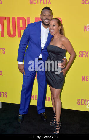 Marlon Wayans and Essence Atkins attending the 'Sextuplets' premiere at Arclight Hollywood on August 7, 2019, in Los Angeles, California Stock Photo