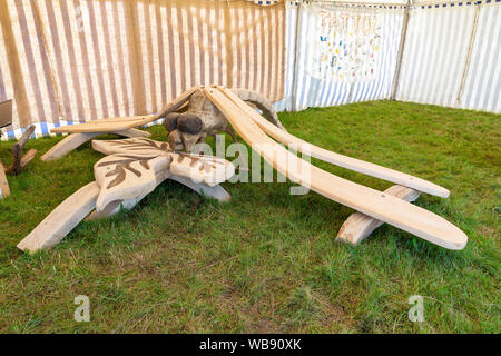 Tabley, Cheshire, UK. 25th Aug, 2019. The 15th English Open Chainsaw Competition at the Cheshire County Showground, England - Oak Dragonfly on display Credit: John Hopkins/Alamy Live News Stock Photo