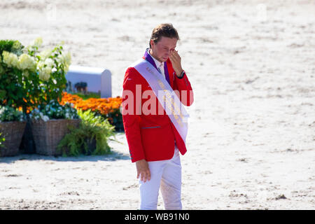 Rotterdam, Netherlands. 25th August 2019. Winner. Gold medal winner Martin Fuchs (SUI) is emotional while on the podium during the national anthem in the prizegiving of the Individual Championship at the at the Longines FEI European Championships. Showjumping. Credit Elli Birch/SIP photo agency/Alamy live news. Credit: Sport In Pictures/Alamy Live News Stock Photo