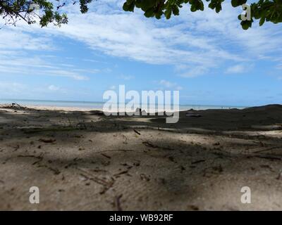 Empty Tinhare beach from the shade, on the Brazil coast near Salvador Stock Photo