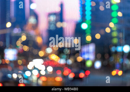 Raining evening in City, Rain, wet Window, drop of water rain on window Stock Photo