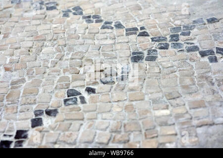Detail of a mosaic floor. A black cross on a white background Stock Photo