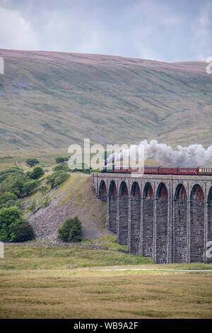The Flying Scotsman crossing the Ribblehead Viaduct or Batty Moss Viaduct on the Settle–Carlisle railway, North Yorkshire, England, UK