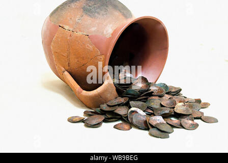 Treasure;Clay pot with antique coins on the white background; Stock Photo