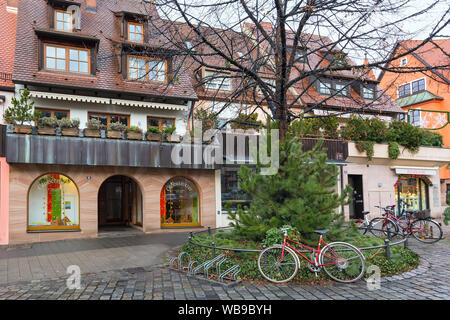 Nuremberg, Germany - December 24, 2016: City street with traditional houses in Bavaria at Christmas time Stock Photo