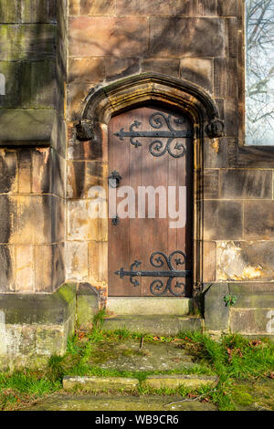 Traditional church door showing wrought iron hinges UK Stock Photo