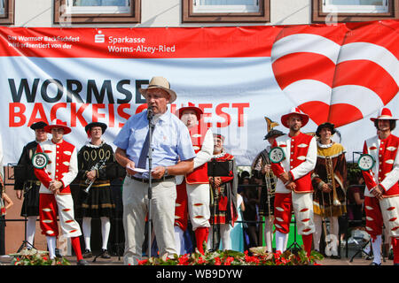 Worms, Germany. 24th August 2019. The Lord Mayor of Worms Adolf Kessel addresses the opening ceremony of the Backfischfest 2019. The largest wine and funfair along the river Rhine, the Backfischfest started in Worms with the traditional handing over of power from the Lord Mayor to the mayor of the fishermen’s lea. The ceremony was framed by dances and music. Stock Photo