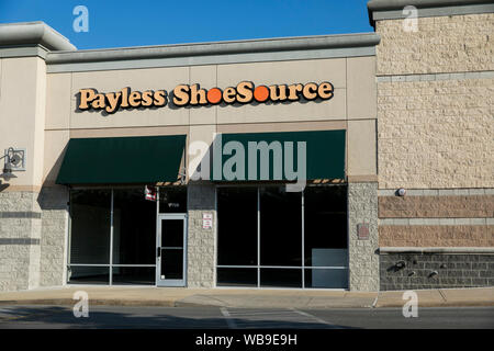 A logo sign outside of an abandoned Payless ShoeSource retail store location in Hagerstown, Maryland on August 8, 2019. Stock Photo