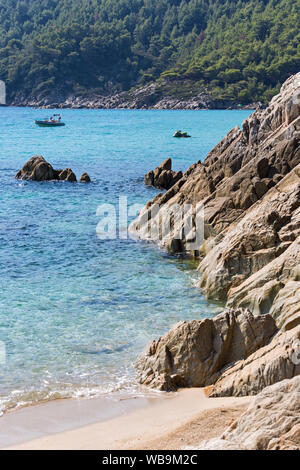 Exotic Platanitsi beach in Sarti, Sithonia, Greece with crystal clear water and spectacular shapes of rocks Stock Photo