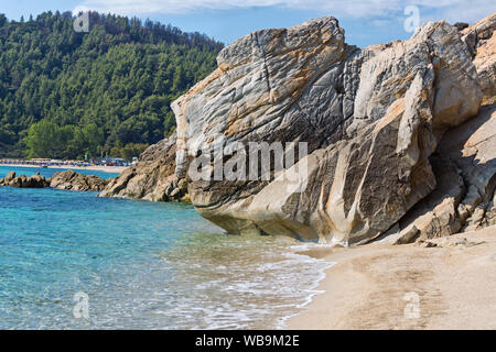 Exotic Platanitsi beach in Sarti, Sithonia, Greece with crystal clear water and spectacular shapes of rocks - The Turtle Head Stock Photo