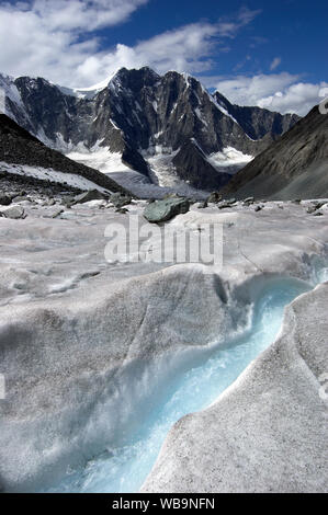 Melt water runnel in ice, Arbuz glacier, Altai mountains, Russia Stock Photo