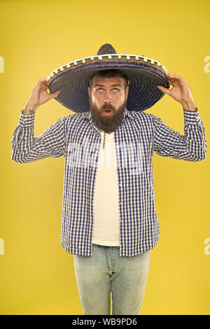Celebrate mexican holiday. Mexican bearded guy ready to celebrate. Customs and traditions. Man wear sombrero mexican hat. Vacation travel festival and holidays. Join fest. Mexican culture concept. Stock Photo