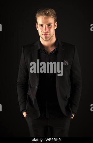 Elegance in simplicity. Rules for wearing all black clothing. Black fashion trend. Man elegant manager wear black formal outfit on dark background. Reasons black is the only color worth wearing. Stock Photo