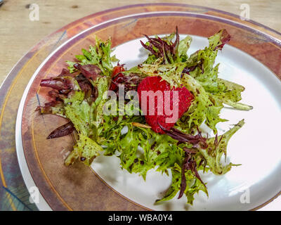 Summer salad with strawberries, blueberries, avocado and balsamic vinaigrette served at 9 Restaurant at North Bellingham Golf Club. Stock Photo