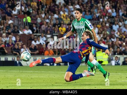Barcelona, Spain. 25th Aug, 2019. FC Barcelona's Antoine Griezmann (front) scores a goal during the 2nd round Spanish league soccer match between FC Barcelona and Betis in Barcelona, Spain, on Aug. 25, 2019. Credit: Joan Gosa/Xinhua Stock Photo