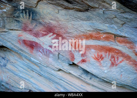 Rock art at the Tombs, a sacred area used as a burial site by the Aboriginal inhabitants of the region.   Vandals and grave robbers had desecrated the Stock Photo