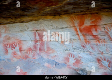 Rock art at the Tombs, a sacred area used as a burial site by the Aboriginal inhabitants of the region.   Vandals and grave robbers had desecrated the Stock Photo