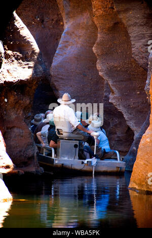 Tour boat in Cobbold Gorge, extremely narrow, in places merely two metres wide, with spectacular 30-m cliffs.    A series of waterholes and rock falls Stock Photo