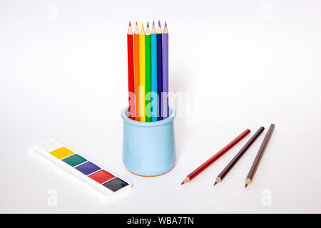 Image with blue vase with pencils on white background for web background design. School equipment set. Stock Photo