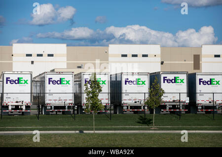 FedEx Ground logos on truck trailers at a FedEx distribution center in Twinsburg, Ohio on August 10, 2019. Stock Photo