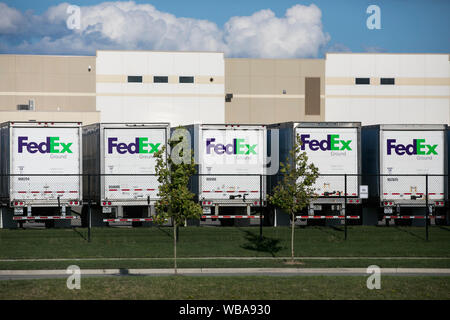 FedEx Ground logos on truck trailers at a FedEx distribution center in Twinsburg, Ohio on August 10, 2019. Stock Photo