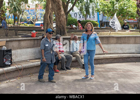 couple dancing in the miguel de cervantes saavedra park in david panama Stock Photo
