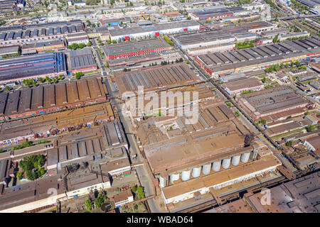 roofs of industrial buildings, aerial view. city industrial park, suburb infrastructure Stock Photo