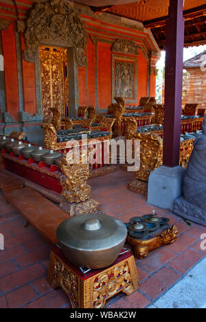 Balinese temple or pura interior. Cymbals, gongs and drums form the basis of Balinese traditional music. Bali, Indonesia Stock Photo