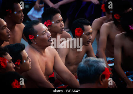 Kecak dancers perform every sunset for tourists. Pura Luhur Uluwatu Temple, Kuta South, Bali, Indonesia Stock Photo