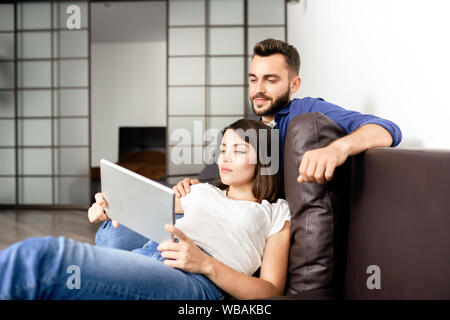 Content beautiful couple in casual clothing resting Stock Photo
