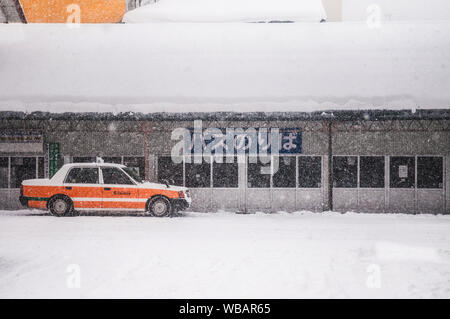 JAN 20, 2014 Aomori, JAPAN : Japan taxi cab at Goshogawara Station,  waiting for passenger during winter time. Stock Photo